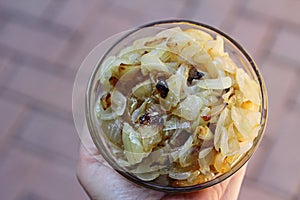 Caramelized onions in a bowl holding
