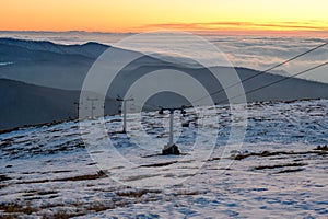 Caras Severin, Romania. chairlift that climbs the small mountain in the evening at sunset