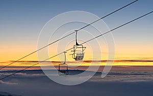 Caras Severin, Romania. chairlift that climbs the small mountain in the evening at sunset