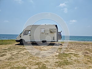 caravan car by the beach in summer holidays modern