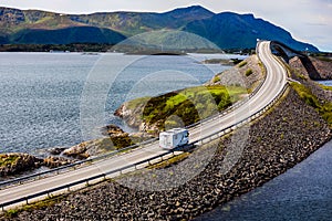 Caravan car RV travels on the highway Atlantic Ocean Road Norway