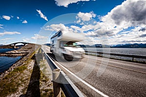 Caravan car RV travels on the highway Atlantic Ocean Road Norway