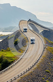 Caravan car RV travels on the highway Atlantic Ocean Road Norway