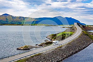 Caravan car RV travels on the highway Atlantic Ocean Road Norway