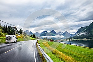 Caravan car travels on highway.