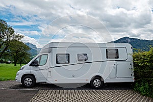 Caravan car vacation. Family vacation travel RV. Holiday trip in motorhome. Switzerland natural landscape