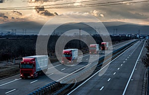 Caravan or convoy of lorry trucks on country highway