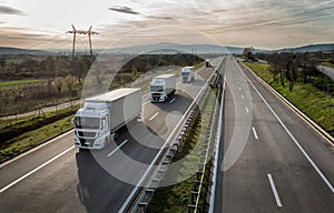 Caravan or convoy of trucks on highway photo