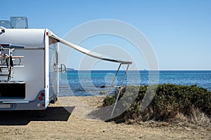 Caravan in front of the sea