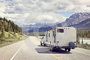 Caravan or motor home trailer on a mountain road