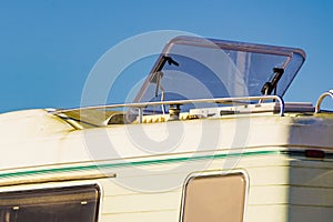 Caravan with open sunroof, raisable window on roof top