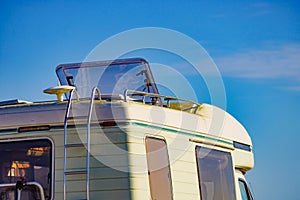 Caravan with open sunroof, raisable window on roof top