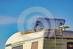 Caravan with open sunroof, raisable window on roof top