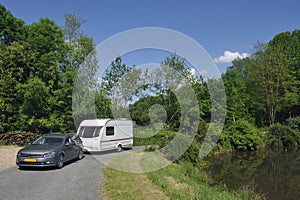 Caravan passing a lake