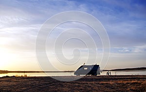 Caravan silhouette in alqueva lake photo