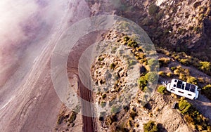 Caravan with solar panels on roof camp on coast, Spain. Aerial view photo