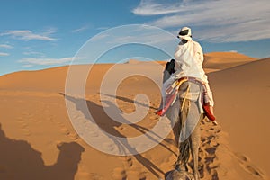 Caravan of tourists in desert