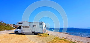 Caravan trailer car by the sea in summer holidays
