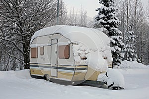 Caravan Trailer Covered in Snow during Winter