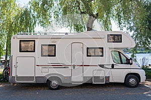 Caravan travel trailer RV motor home camper. Car vehicle journey. Tourism Summer vacation holidays activity trip to Europe. Mobile