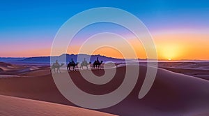 Caravan travelling over dunes in the desert