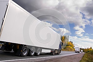 Caravan of trucks on highway