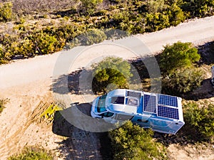 Caravans with solar panels on roof camping on nature