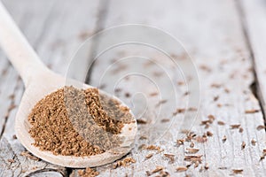 Caraway Powder on a wooden spoon photo