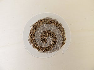 Caraway seeds on a wooden board