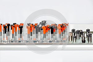 A set of various carbide tipped cutters and collet holders for woodworking photo