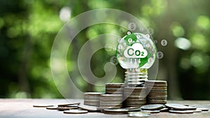 Carbon credit and tax concept.light bulb with Co2 credits,tax icon.Legal regulation to reduce greenhouse gas emission and