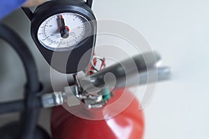 Carbon dioxide or CO2 fire extinguisher is a tank that needs to be checked by weighing only