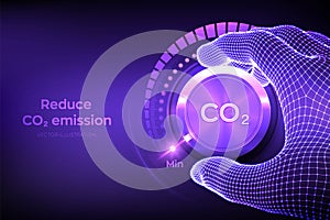 Carbon dioxide emissions control concept. Reduce CO2 level. Wireframe hand turning a carbon dioxide knob button to the