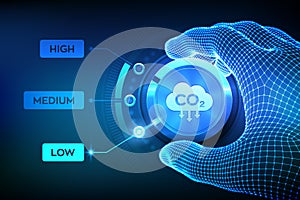 Carbon dioxide emissions control. Reduce CO2 to limit global warming and climate change. Wireframe hand setting a carbon dioxide