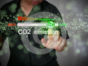 Carbon dioxide emissions control and reduction or removal to limit global warming and climate change. A man adjusting the volume