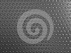 Carbon fibre background with round shapes