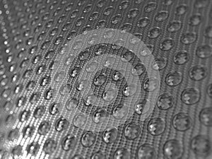 Carbon fibre surface with round shapes pattern