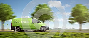 Carbon-neutral delivery with a green van driving on a country road with green trees