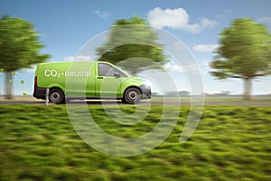 Carbon-neutral delivery with a green van driving on a country road with green trees