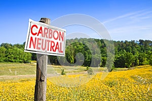 Carbon Neutrality in agriculture - CO2 Net-Zero Emission concept with placard in a rural scene
