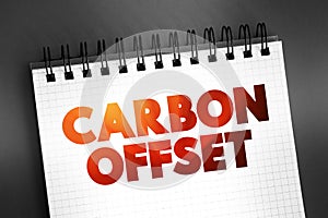 Carbon offset - reduction of emissions of carbon dioxide made in order to compensate for emissions made elsewhere, text concept on