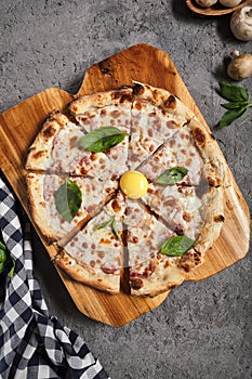 Carbonara pizza with bacon and eggs