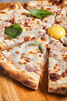 Carbonara pizza with bacon and eggs