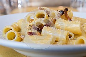 Carbonara is Rigatoni alla carbonara is a specialty dish from lazio region and Roma sorround photo