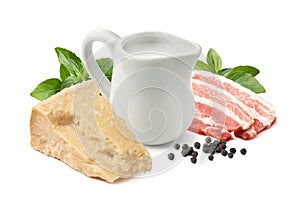 Carbonara sauce ingredients. Parmesan cheese, Italian bacon, green basil, fresh cream and black pepper grains isolated on white