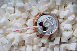 Carbonated soda drink with many sugar cubes. Unhealthy eating concept