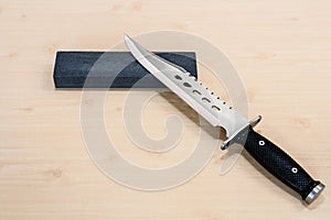 Carborundum stone and knife photo