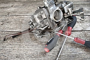 Carburetor and screwdrivers