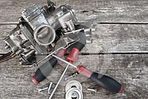 Carburetor and screwdrivers