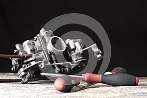 Carburetor and screwdrivers photo